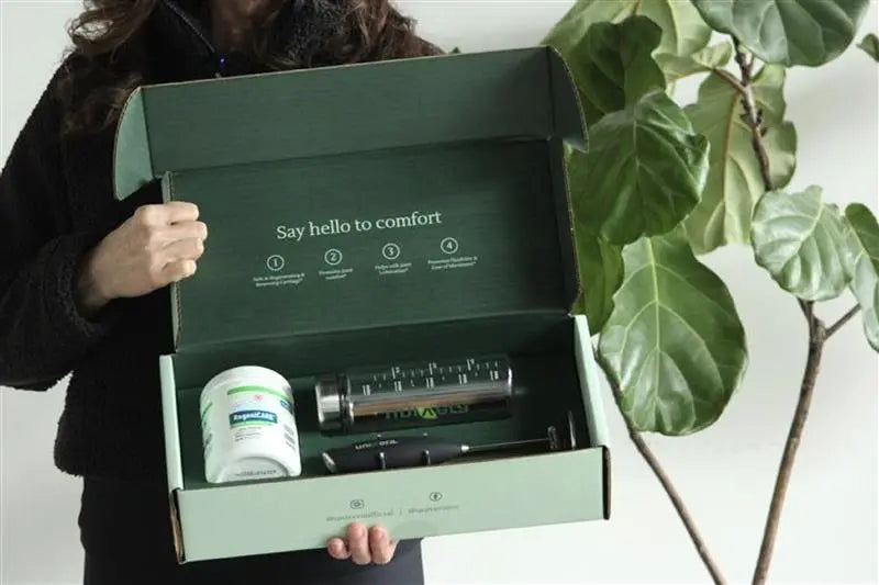 Person holding a Univera RegeniCARE® joint health gift set.