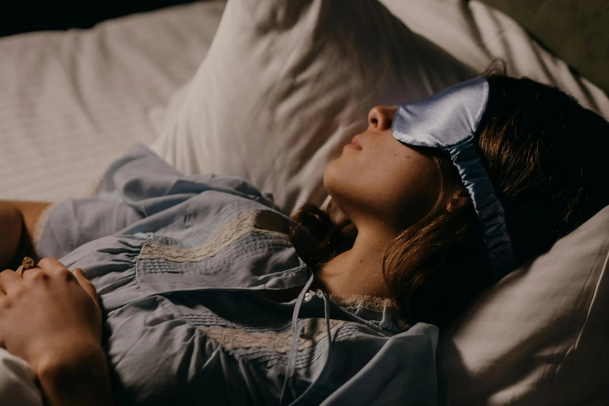 person sleeping soundly with a sleeping mask