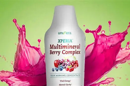 xperia bottle with pink liquid and green background