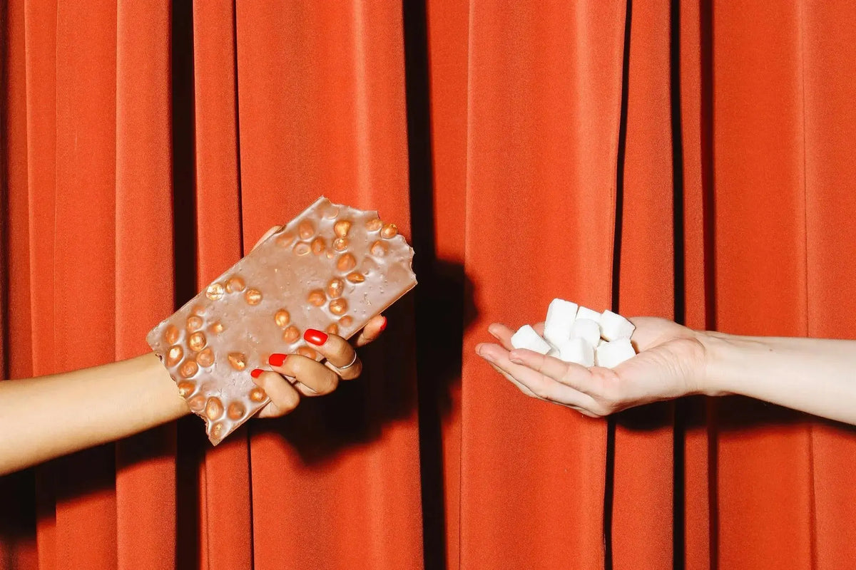 hand holding chocolate and sugar