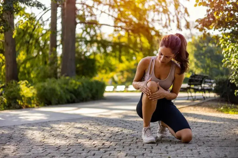 a woman streching in the park