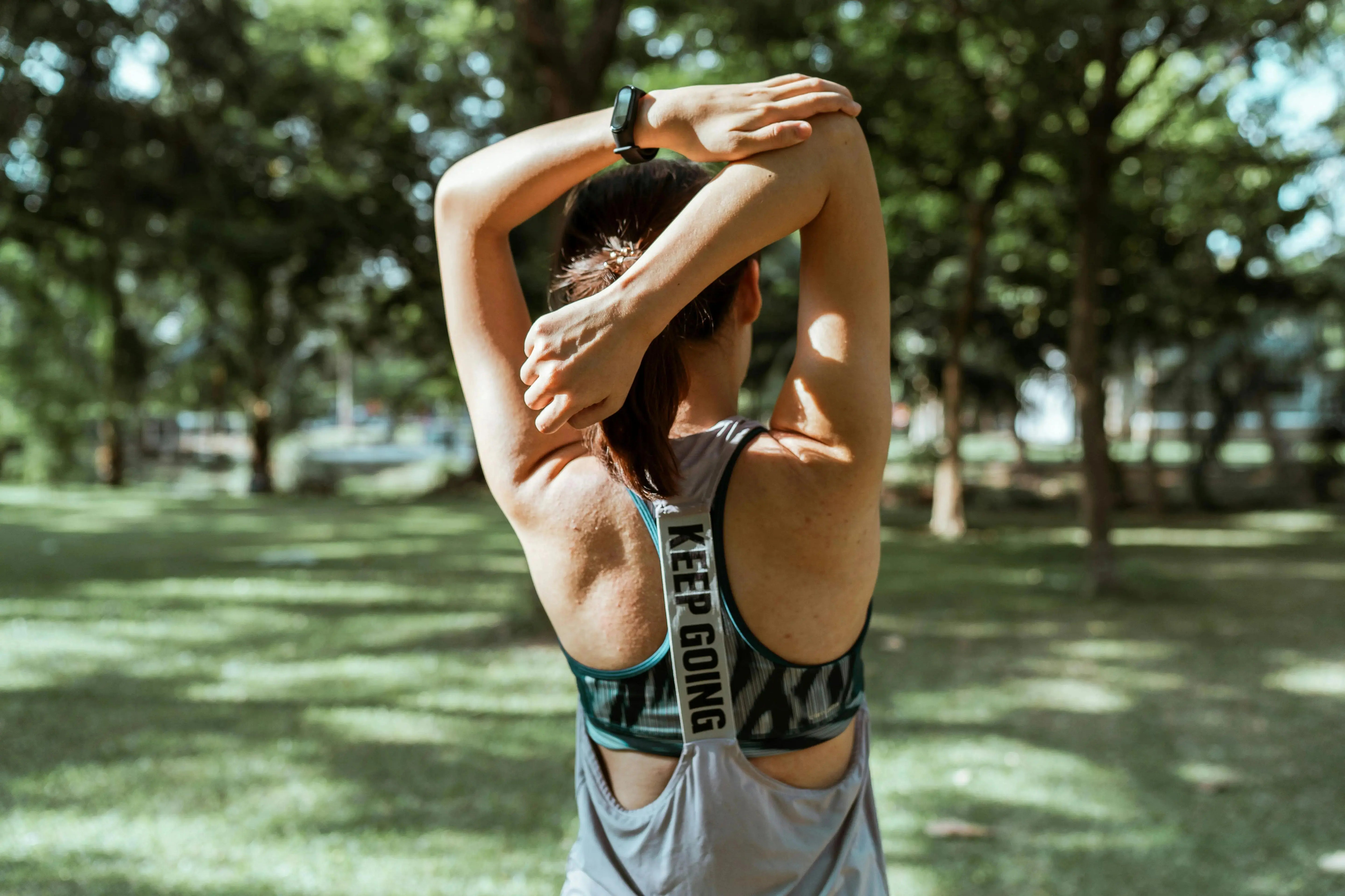 woman streching in the park