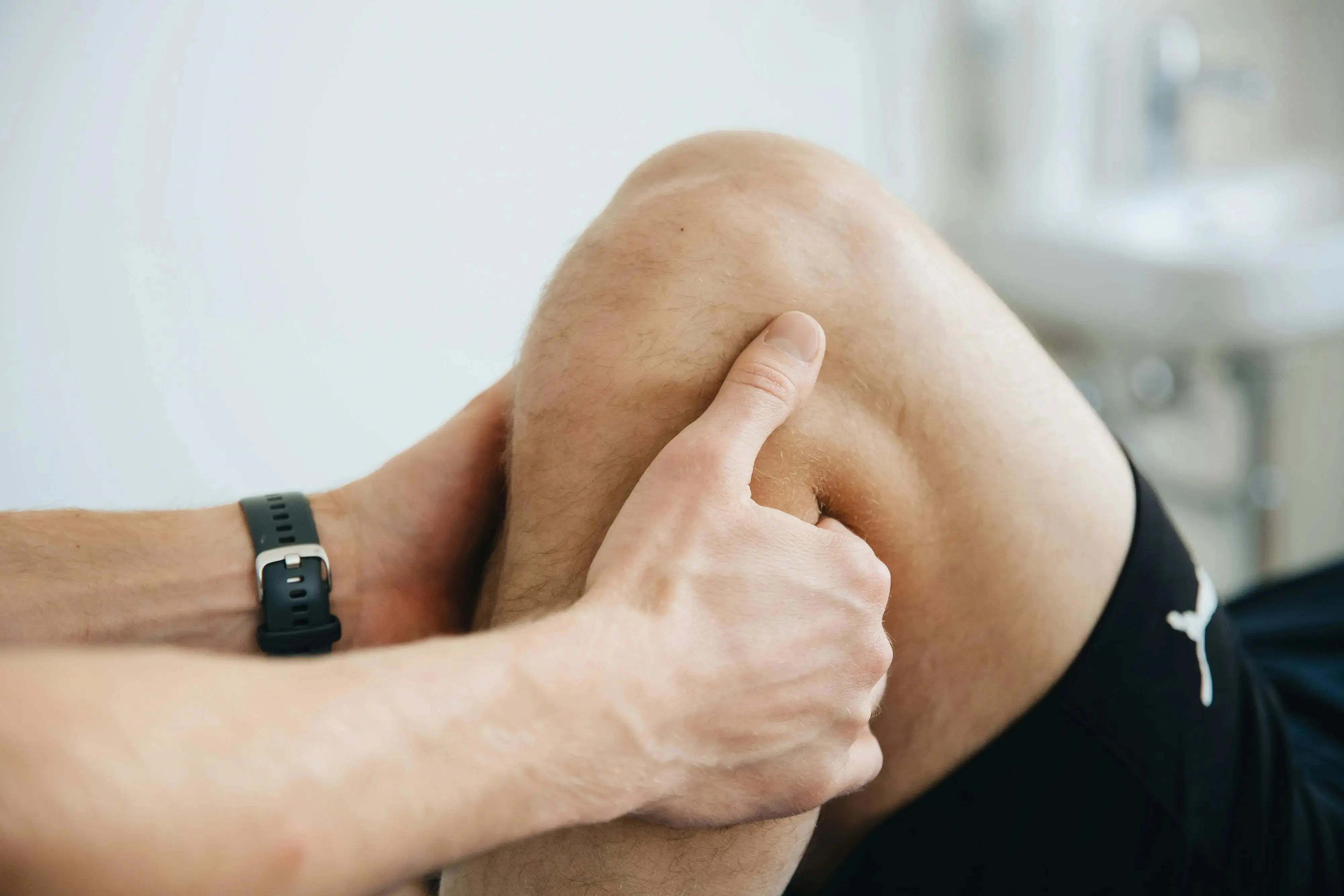 a persons knee being stretched