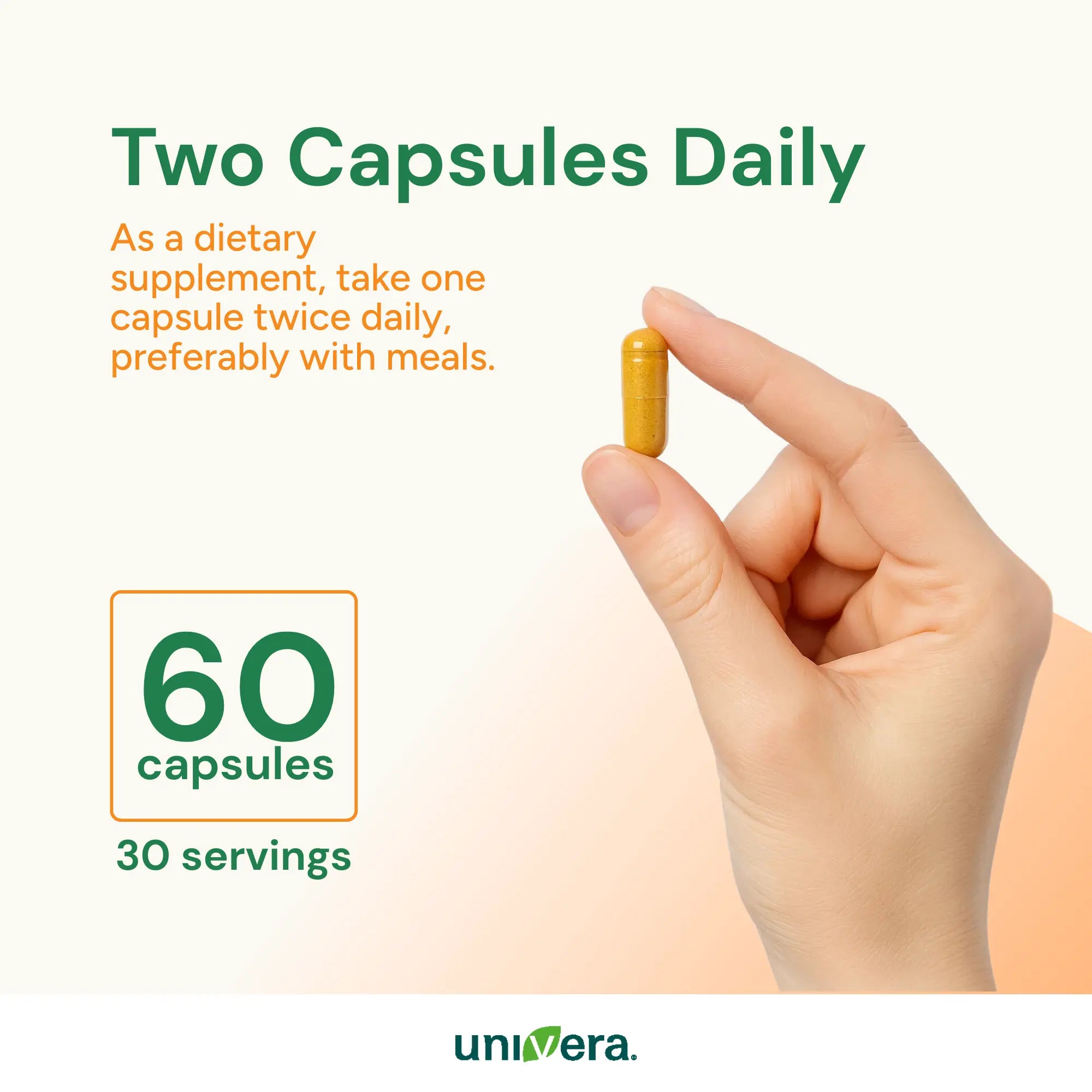 Hand holding a capsule with supplement information on a white background