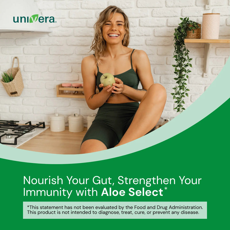 Woman holding an apple in a kitchen with 'univera' branding and promotional text about Aloe Select.